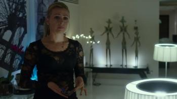 The Pass: Lisa Mcgrillis in a hotel room holding a phone looking upset.