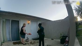 The Perfect Neighbor: Police talk with a woman.