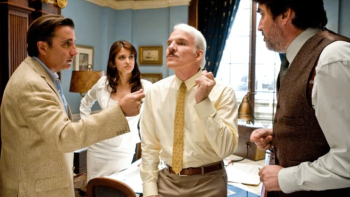 The Pink Panther 2 movie: The other investigators surround and look at Clouseau in an ornate office