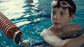 The Plague movie: Everett Blunck is in the water, looking at what's happening around him