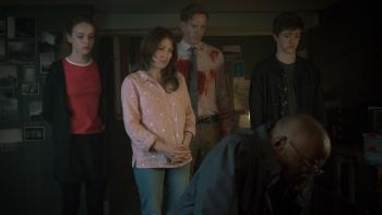 The Radleys: Kelly Macdonald, Damian Lewis, Bo Bragason, and Harry Baxendale stand and watch as Shaun Parkes kneels down looking sad