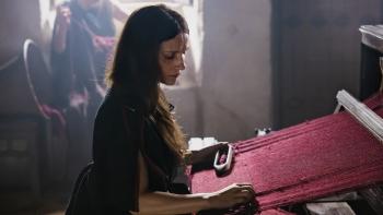 The Return: Juliette Binoche weaves a red garment on a loom
