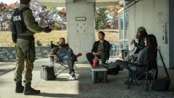 The Rip: Police relax on folding chairs.