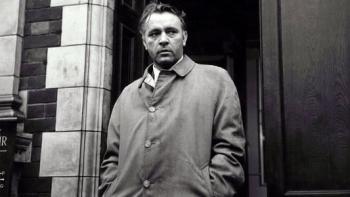 The Spy Who Came in from the Cold: Richard Burton stands in doorway wearing overcoat