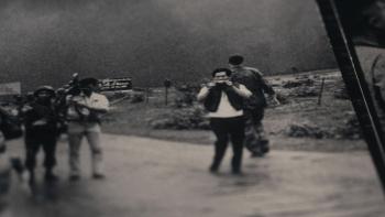 The Stringer: The Man Who Took the Photo movie: Photograph of a photograph showing a Vietnamese man holding a camera with other photographers on road