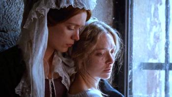 The Testament of Ann Lee movie: The founder of the Shakers, Jane Wardley (Stacy Martin), comforts a sad Ann Lee (Amanda Seyfried)