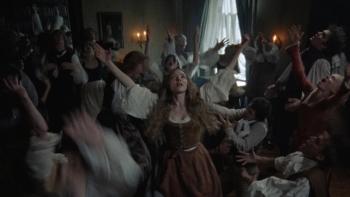 The Testament of Ann Lee movie: Amanda Seyfried dances in the middle of a cluster of people, her arms thrown up in exaltation
