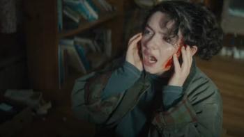 The Unheard: Chloe plugs her ears and looks scared. 