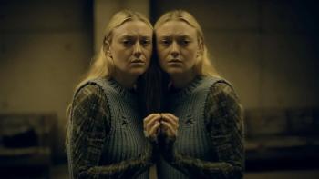The Watchers Movie: Dakota Fanning leans against a mirror