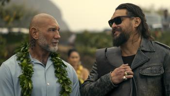 The Wrecking Crew: Dave Bautista and Jason Momoa look at each other.