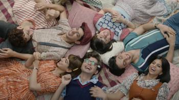 The Archies: The gang lies on the ground as a group.