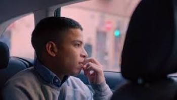 The Bad Family: A boy looks out the window