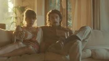 The Big Fake movie: Pietro Castellitto  on a couch with a woman
