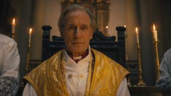 The First Omen Movie: Cardinal Lawrence (Bill Nighy) oversees a solemn ceremony