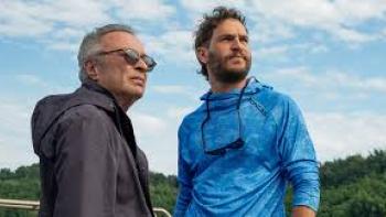 The Giant Falls movie: Two men stand outside