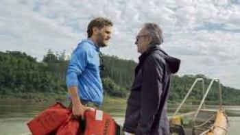 The Giant Falls movie: Two men face off by a boat