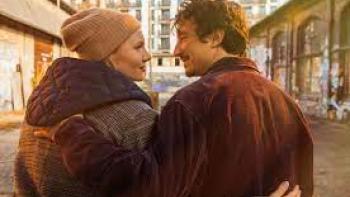 The Heartbreak Agency: A man and woman walk with arms around each other 