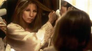 The Mirror has Two Faces: Barbra Streisand blow-dries her hair