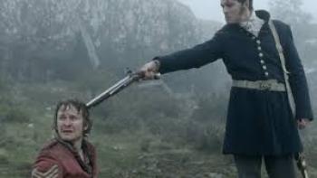 The Nightingale: Solider holds gun to head of kneeling man