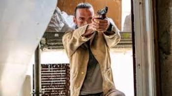 The Orphans: Man in tan jacket aims gun