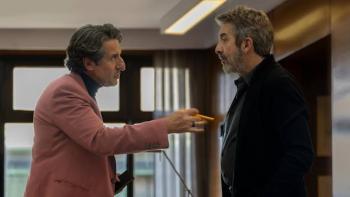 Therapy Done Right Movie: Two men in an office having a serious conversation.