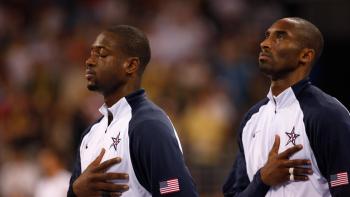 The Redeem Team members Dwyane Wade (left) and Kobe Bryant (right) in a Pledge of Alliance stance.