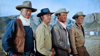 The Sons of Katie Elder: Four White men in cowboy hats stand in a line.