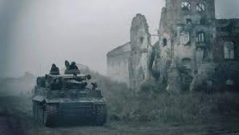The Tank Movie: Tank rolls in past building in ruin