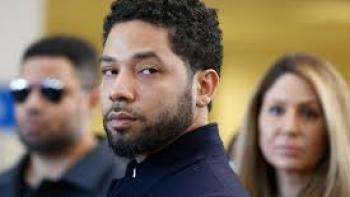 The Truth about Jussie Smollett: Jussie Smollett with 2 people in background