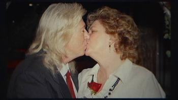 The Widower: A couple kissing, with one wearing a suit and the other a white blouse.
