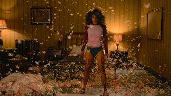They Will Kill You Movie: Asia (Zazie Beetz) stands, bloodied and determined, in a room full of airborne mattress fluff