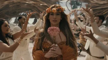 This is Me… Now: A Love Story: Jennifer Lopez holds a flower.