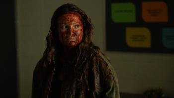 This Is Not a Test Movie: In the school, Sloane (Olivia Holt) is covered in blood and looks to be somewhat in shock