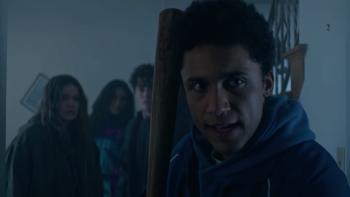 This Is Not a Test Movie: Cary leads the group through the school hallways, a baseball bat at the ready