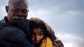 Thrash: Djimon Hounsou holds Whitney Peak.