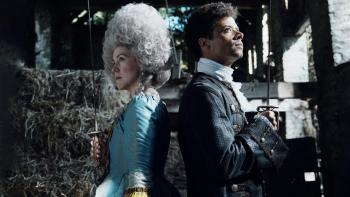Timestalker: Alice Lowe and Jacob Anderson stand back to back, fencing swords raised, preparing to duel
