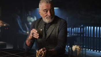 Tin Soldier Movie: Ashburn (Robert De Niro) raises a drink in a bar and looks at someone to his left