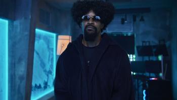 Tin Soldier Movie: The Bokushi (Jamie Foxx), wearing dark glasses, stands ominously in a room full of glowing blue windows
