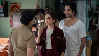 Toaster: An Indian husband and wife talking with a female police inspector in a living room setting