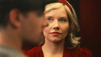 Tonight You’re Sleeping With Me: Roma Gasiorowska looks at the camera and we see the profile of a man's face