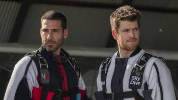 To the Max Movie: Two men in skydiving suits with focused expressions.