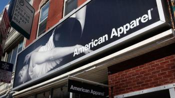 Trainwreck: The Cult of American Apparel movie: Billboard American Apparel ad shows woman in white t-shirt and black underwear in provocative pose