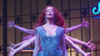 Transmitzvah: A woman performs with hands behind her