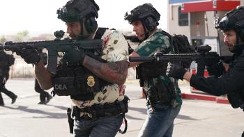 Trap House Movie: Wearing helmets and raid gear and carrying rifles, Ray and Andre prepare to invade a drug den