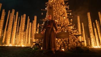 28 Years Later: The Bone Temple Movie: Dr. Ian stands in front of the bone temple, a foreboding light all around