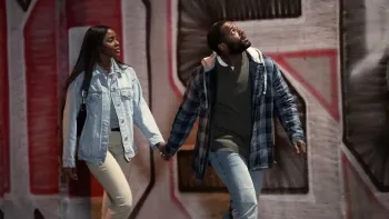 Tyler Perry’s Doing Life: Jay Reeves and Naomi Baker in front of graffiti.