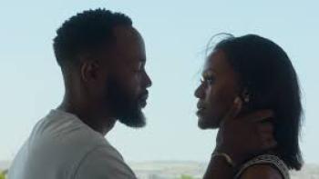 Umjolo: Day Ones: Black man and Black woman look at each other