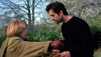 Unconditional Love: Kathy Bates points something out to Rupert Everett in a wooded yard