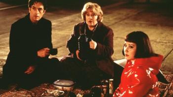 Unconditional Love: Rupert Everett, Kathy Bates, and Meredith Eaton sit together on a picnic blanket in an underground space