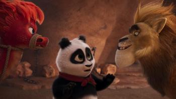 Panda Bear in Africa:  A panda bear talks to a large lion with a calming look on his face. 